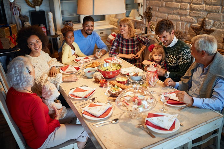 large family at dinner table for holiday gathering - talking - your family